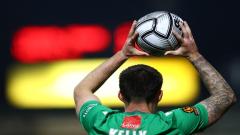 A Yeovil Town player takes a throw-in